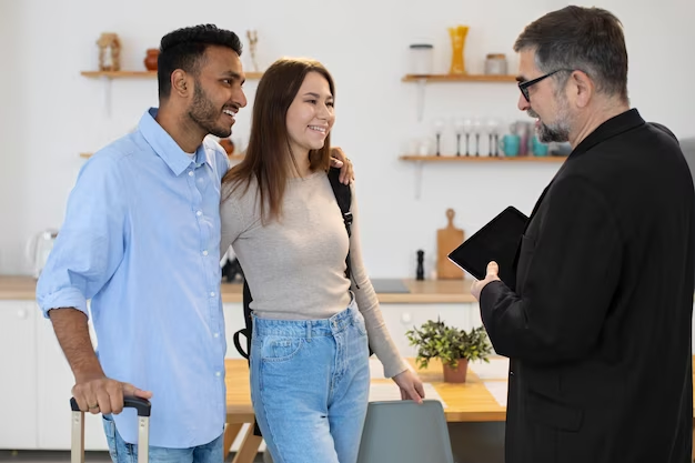 Couple conversing with a vacation rental host.