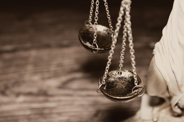 Related Legal: A gavel and scales of justice symbolizing the legal system
